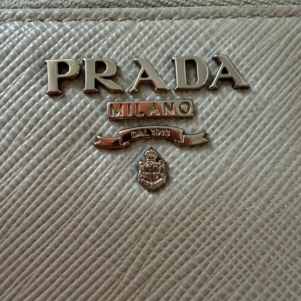 Authentic Prada Gray Leather wallet with mint interior